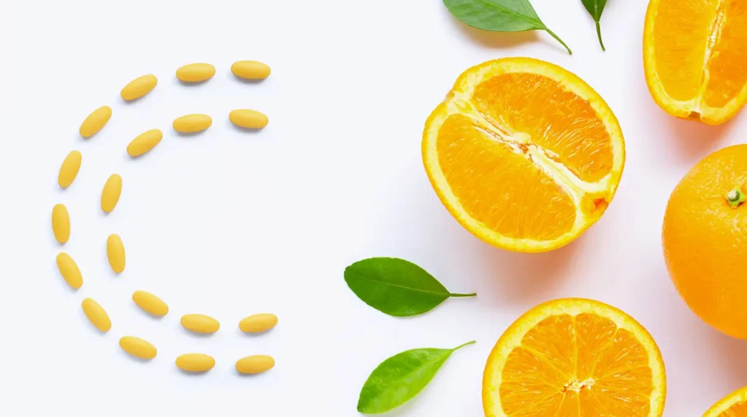 vitamin-c-pills-with-fresh-orange-citrus-fruit-isolated